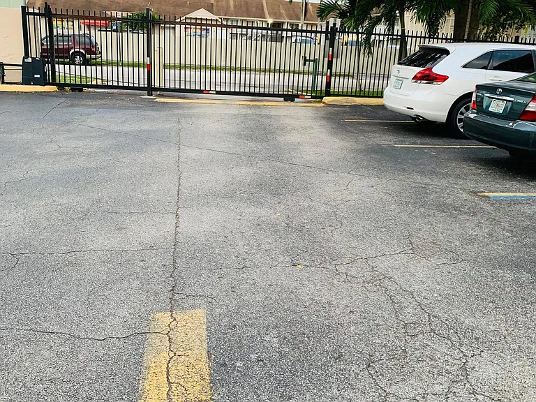 Condominium, Gated Parking Lot.