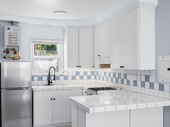 Kitchen with flash water heater (never run out of hot water)