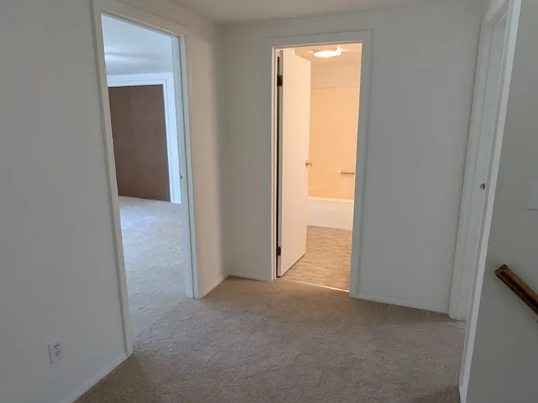 Upstairs landing - Brand new carpets throughout! Looking at primary bedroom, upstairs bathroom, and second bedroom (on right)