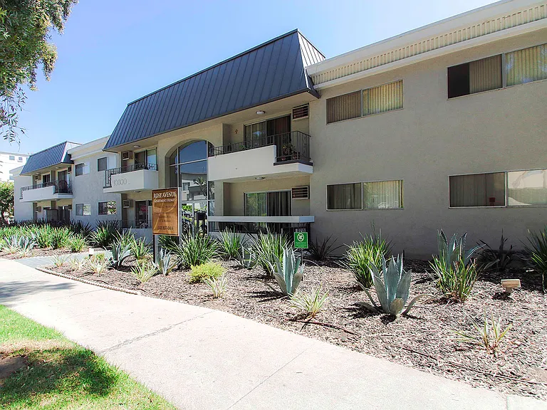 Drought-tolerant greenery decorating the entrance to Rose Apartments.