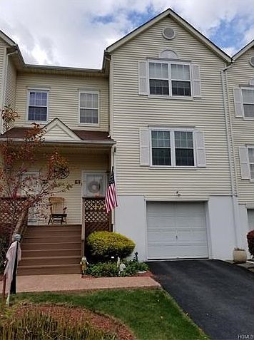 Front With 1 Car attached Garage.