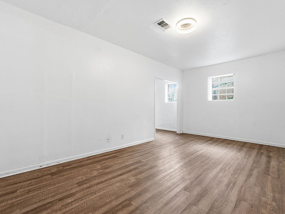 The lower level features a separate studio-style suite with its own full bathroom, kitchen, and private entrance ideal for a guest suite, home office, or bonus living space.