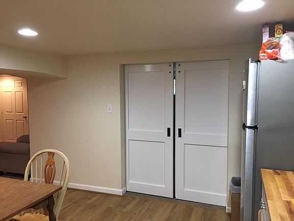 Barn doors to bedroom #2, which can also be a den. To the left, living room.