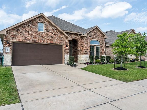 Brick and stone elevation, 2 car garage.