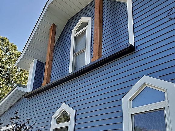 Blue Vinyl Siding with Cedar