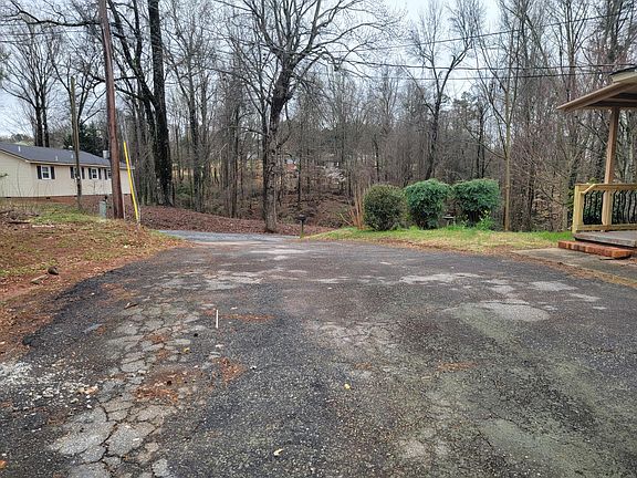 Driveway on side of house, wide enough for two cars