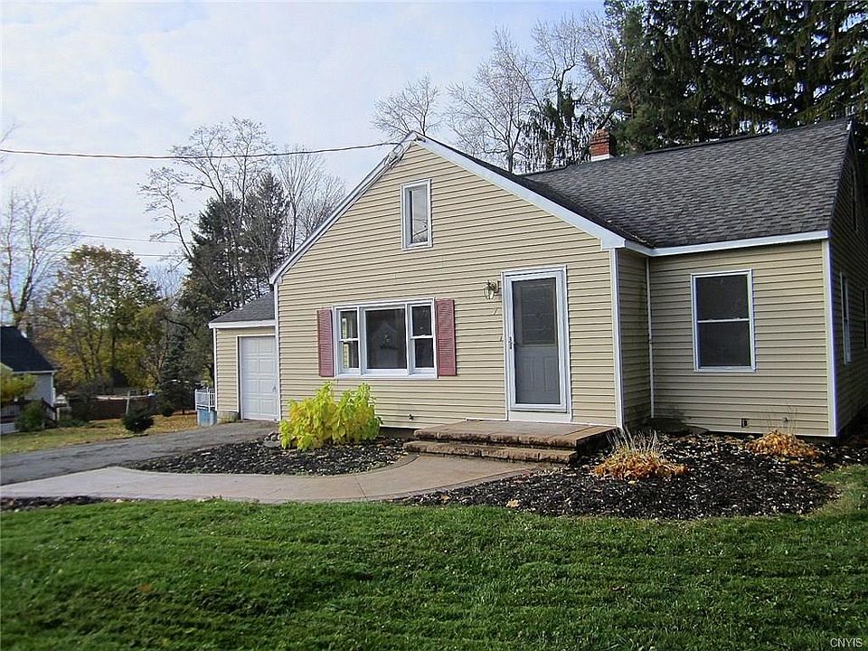 This Cape Cod boasts easy-care vinyl siding, a newer roof, newer front door & storm, Stampcrete walkway to the front steps with flower beds on both sides.