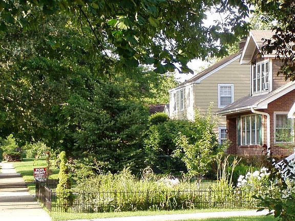 Our red brick bungalow is located on beautiful Indiana Street near downtown Elmhurst.