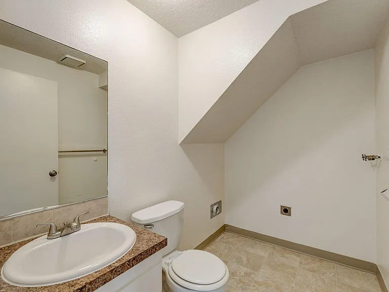 Downstairs half bath with washer and dryer hookups