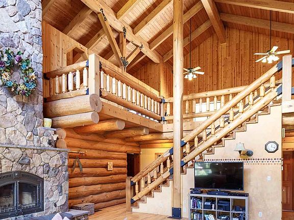 Stairs lead to huge second floor common area with 2 bedrooms, office and full bath.