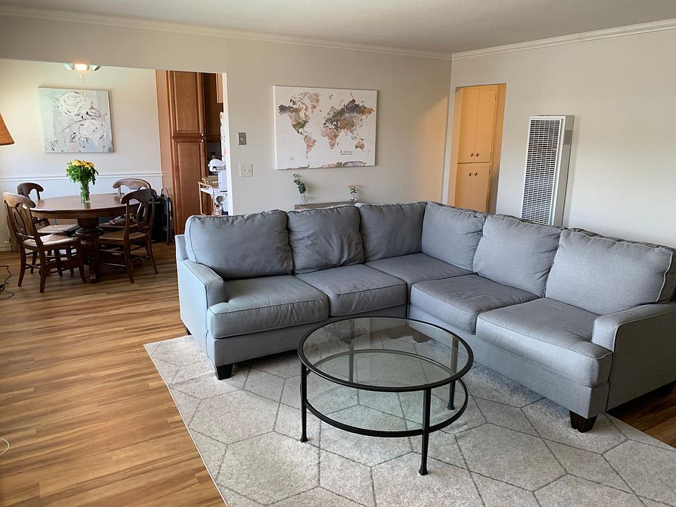 Spacious living area with hardwood flooring throughout. **Note unit does not come furnished**