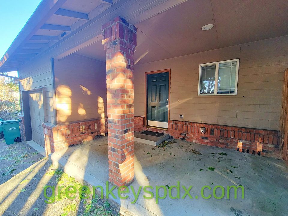 Front door and nice brick column, covered porch