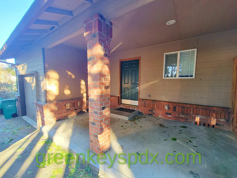 Front door and nice brick column, covered porch