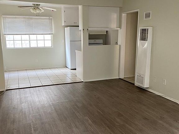 View of the living room/dining room area from front door.