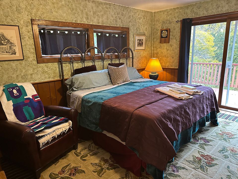 master bedroom, has private bath, deck and seating for 8 people as needed.