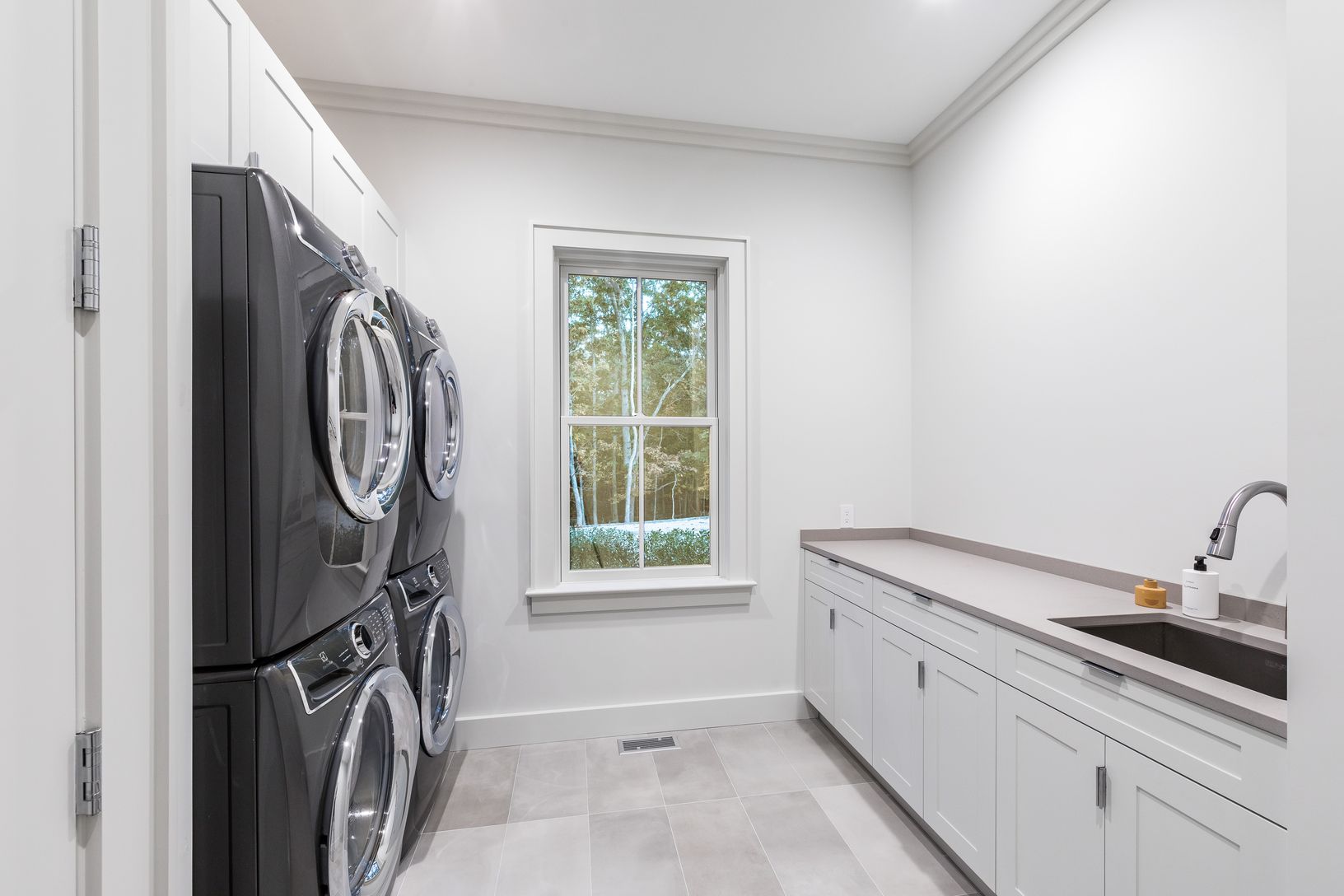  1st Floor Laundry | Double Stack Washer/Dryer and Sink/Storage with Matte Grigio Tile