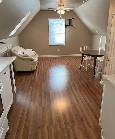 View from top of stairs into living space