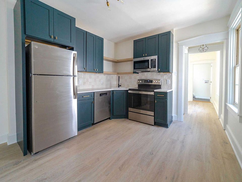 Remodeled Kitchen with Quartz and tile backsplash
