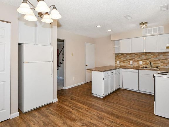 Nice eat in kitchen with pantry and the refrigerator stays!