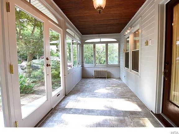 Enter through the heated front porch.  Enjoy summer nights looking out onto the neighborhood.