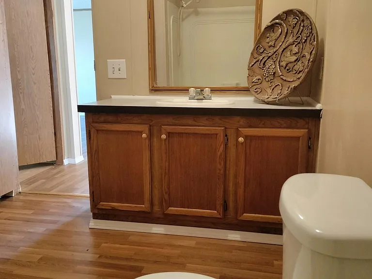Second restroom overlooking the three bedrooms and the laundry room.