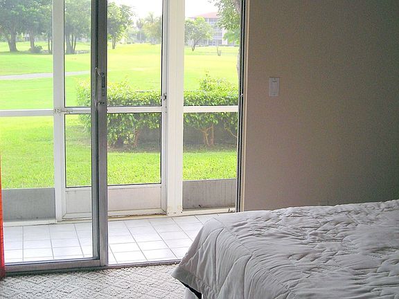 sunny view of lake outside bedroom