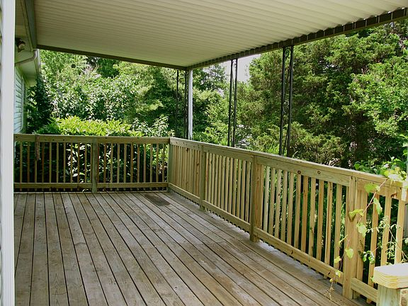 Large covered deck on back to enjoy private backyard