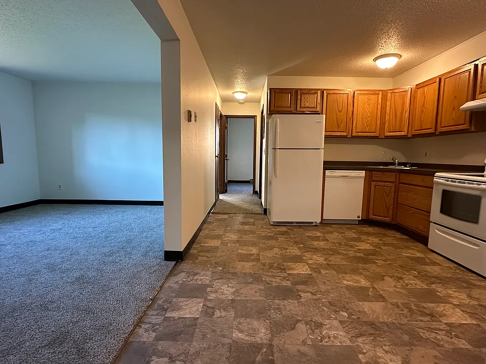 Wide angle of kitchen and living room