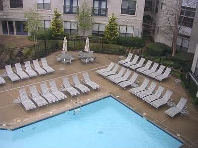 Residents enjoy the pool area.