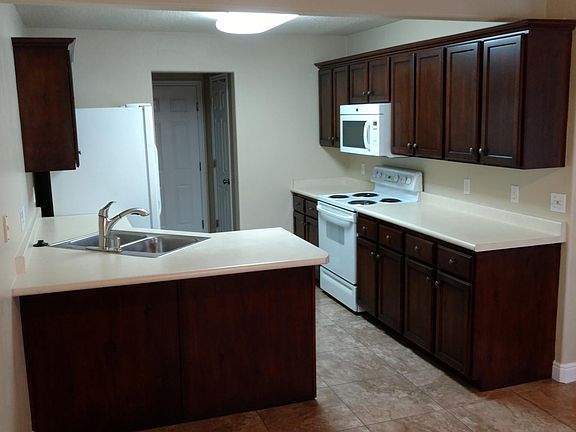Kitchen - thru the doorway is the pantry, laundry hookups and garage door