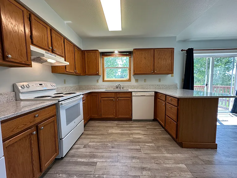 Kitchen has recent updates with new flooring and countertops