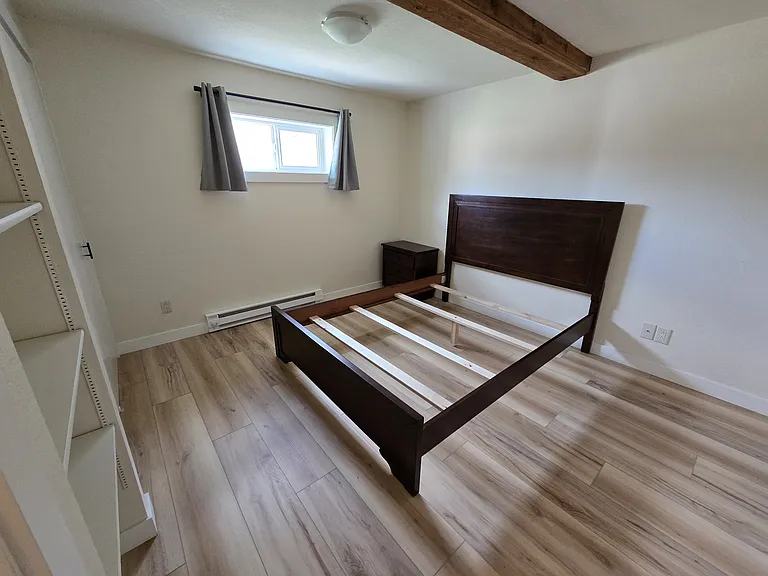 The north bedroom has a huge closet and built-in shelves. Bed frame and bureau optional.