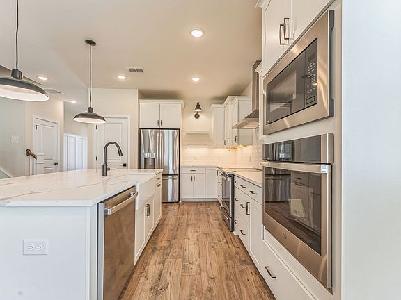 Kitchen with wall oven and stainless steel appliances