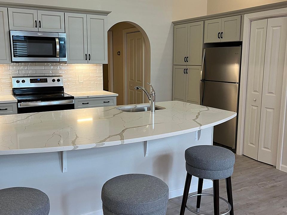 Brand new cabinets and stove, microwave, refrigerator and floor! Dishwasher and disposal also