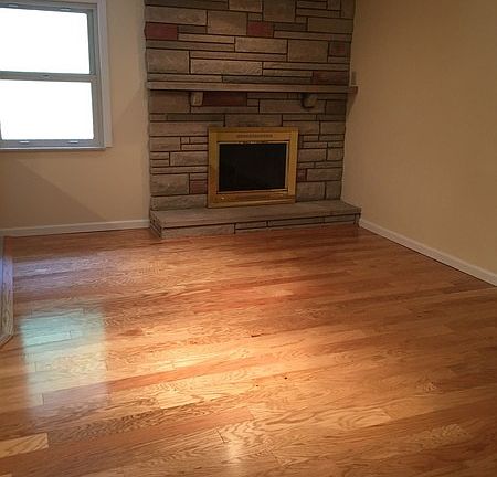 Lovely dining room with new hardwood
						:
						Dine by the fire for lovely atmosphere. Newly installed hardwood.