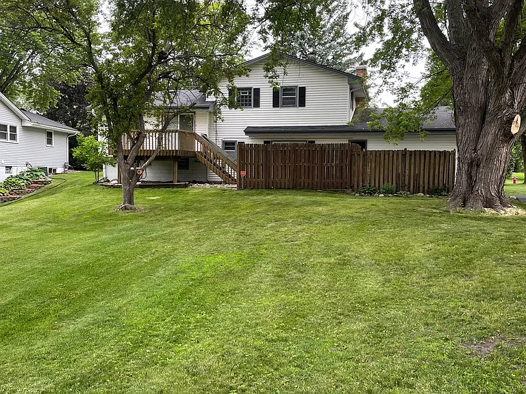 Large treed backyard.
