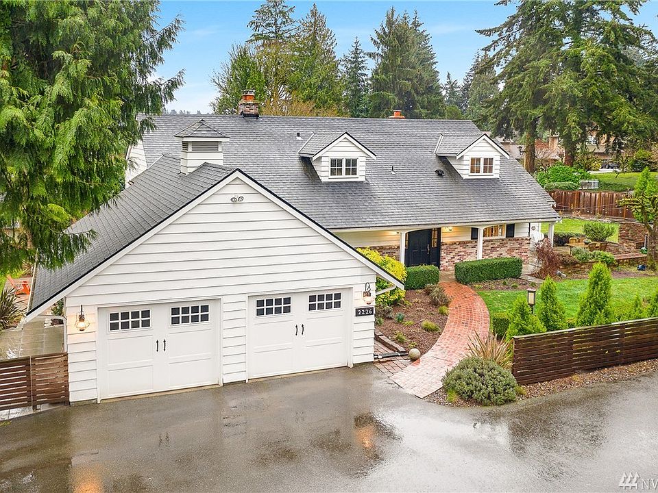 Your modern white farm house in Enatai awaits! With over 13000sqft flat lot and 2 patios, raised bed garden, outdoor fireplace etc... Welcome home! 