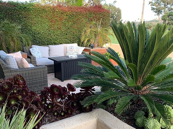 Private seating area at corner of patio. No view of neighbors on either side.