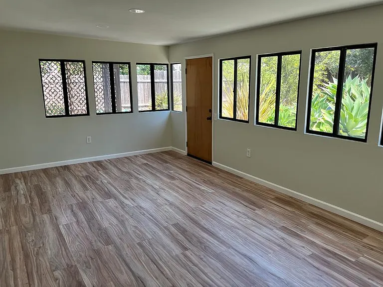 Large family room with garden views is great for entertaining or kids playroom.