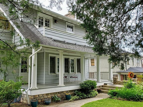 Side walk leading to front door which opens into an interior foyer leading upstairs to the apt. Notice upstairs balcony.