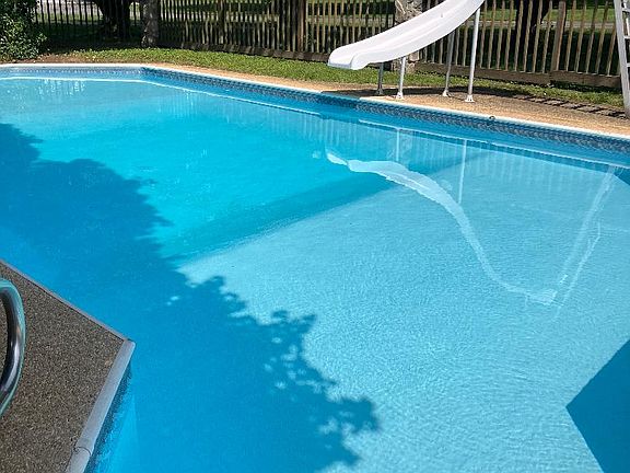 Lovely inground pool with slide for the children.