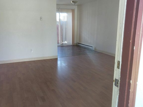 living room and sliding glass door to east side parking lot