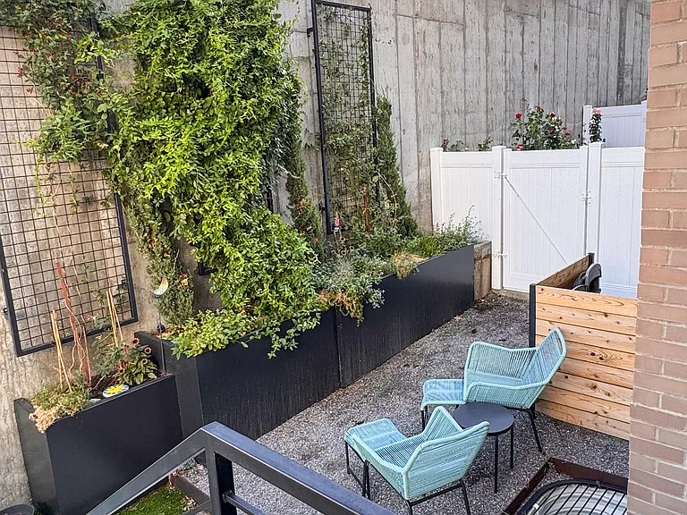 Private, fenced outside oasis with premium, modern landscape features. BBQ grill included.