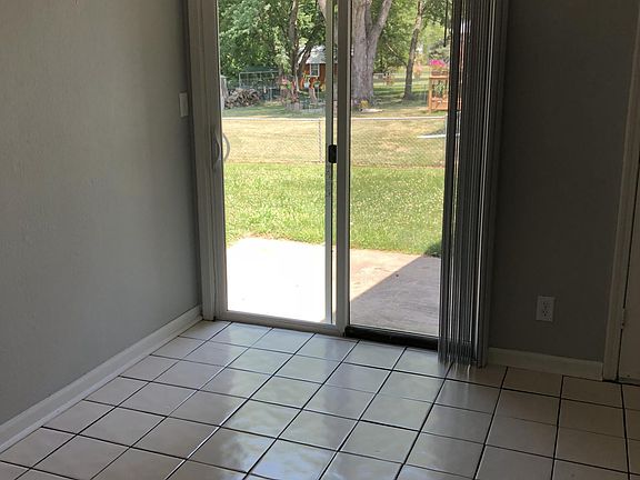 Exit to back yard from eat in kitchen area