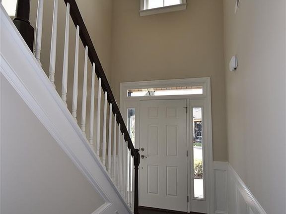 Two story entrance with natural lighting