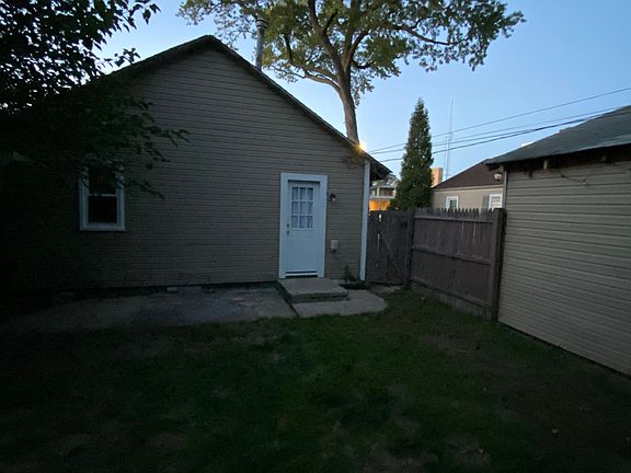 Back of the house, gate, and side of the garage