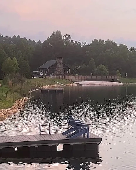 This is our community lake. The pavilion is usable and has picnic tables. There is a designated "beach area" with sand. There are a couple of community decks to fish from ( catch/release). You can use non motorized boats ( kayaks/canoes),floaters.