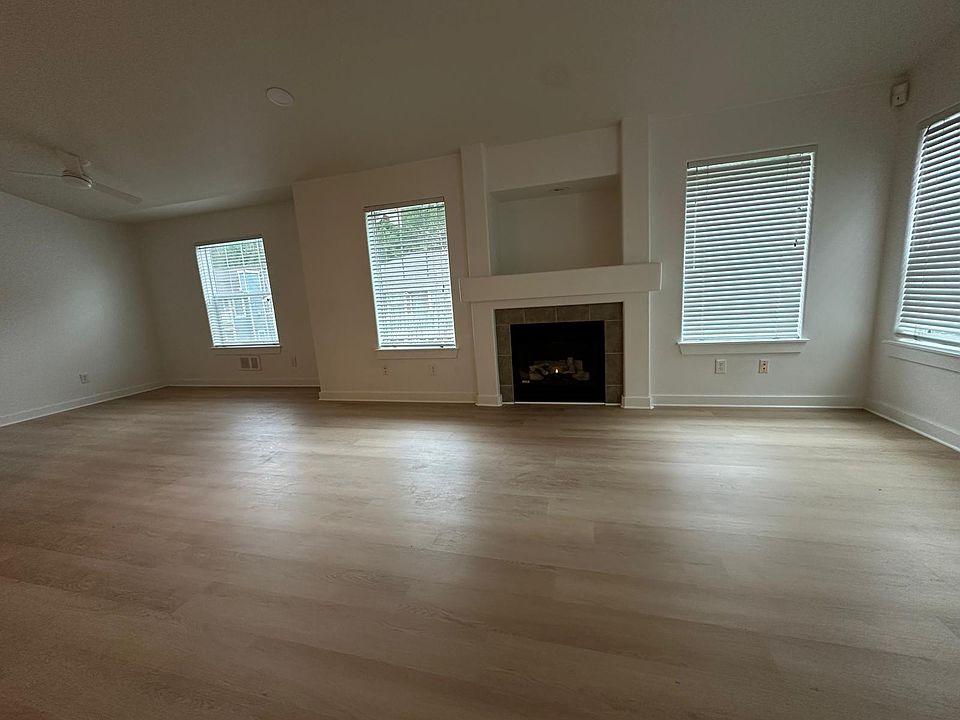 Living room and dining room with nook and fireplace