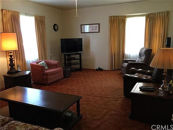 The spacious, open living room is large enough to include a dining room table as well.