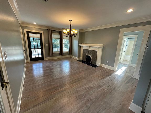 Grand and open living room flooded with natural light!